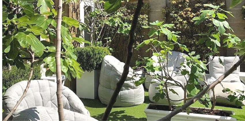 woman relaxing on an ambient lounge outdoor butterfly sofa