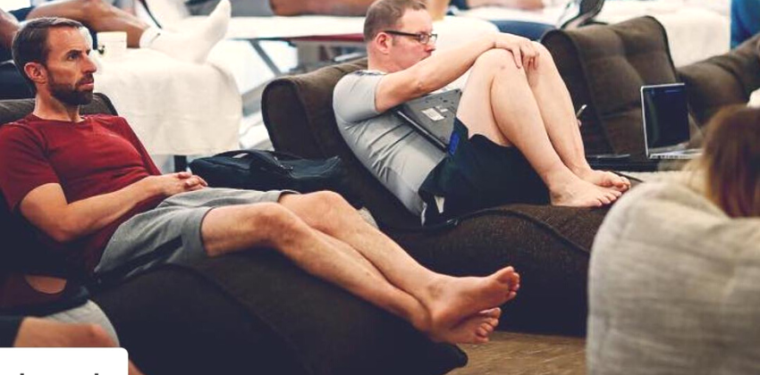 men sitting and watching on an ambient lounge Avatar sofa