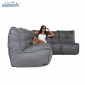 Woman lounging on a Mod4 L titanium weave lounge set from ambient lounge in new zealand