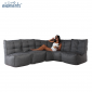 Woman enjoying while sitting on a Mod4 L titanium weave lounge set from ambient lounge in new zealand