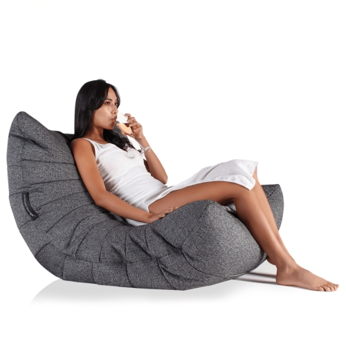 Woman lounging on a titanium weave acoustic sofa bean bag from Ambient lounge in New Zealand