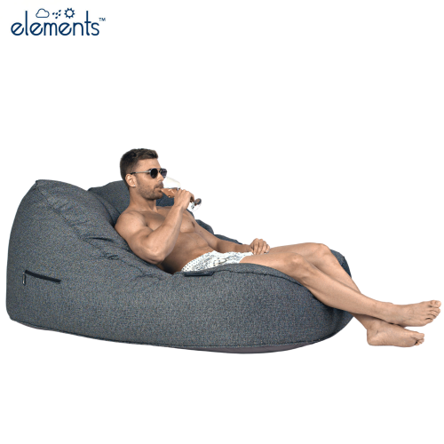 Man sitting on a satellite twin sofa in titanium weave fabric from ambient lounge in New Zealand