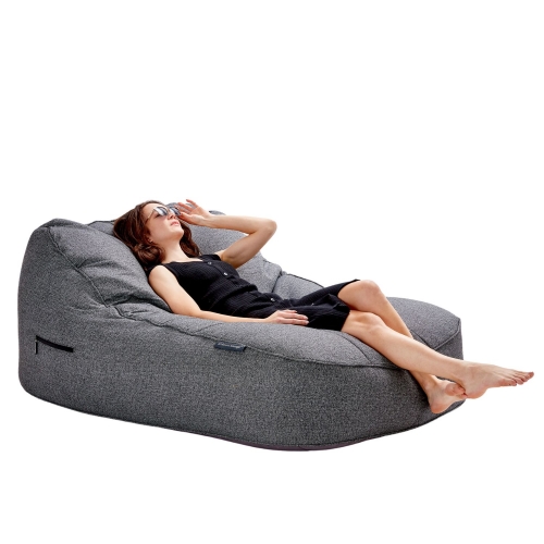 Man sitting on a satellite twin sofa in titanium weave fabric from ambient lounge in New Zealand