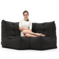 Modular bean bag corner in Black Sapphire with model lounging