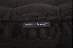 Modular bean bag corner in Black Sapphire with model lounging