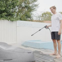 Man sitting on a satellite twin sofa in titanium weave fabric from ambient lounge in New Zealand