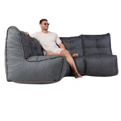 Man sitting on a Mod 3 Cozy Corner Titanium Weave from ambient lounge in New Zealand