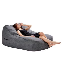 Man sitting on a satellite twin sofa in titanium weave fabric from ambient lounge in New Zealand